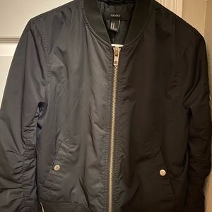 Black bomber jacket from forever 21 and it’s a medium in women